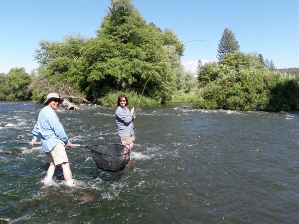 Arnie about to net Pam Shier's mystery fish