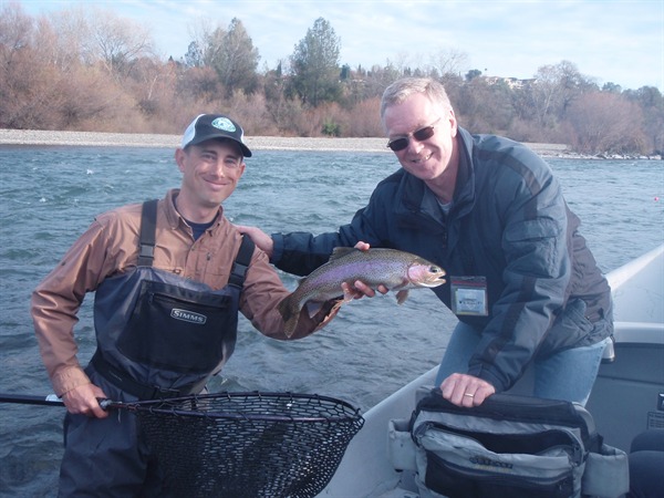Colin with his 2nd big rainbow of the day.