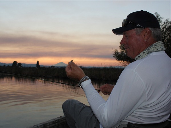 Gino holds up a hex pattern next to Mt Shasta