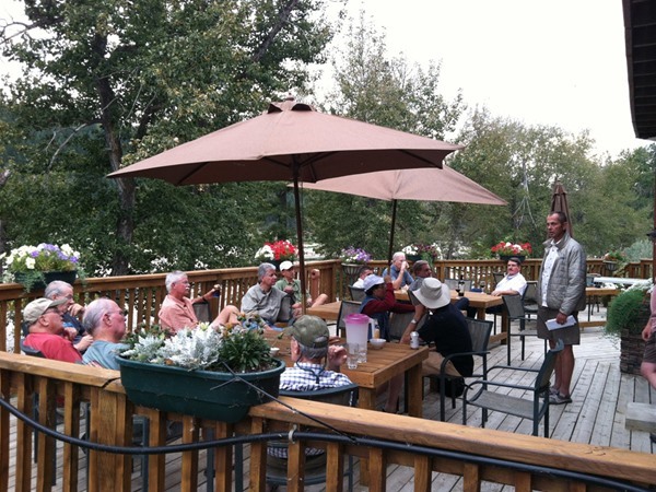 The whole group on the deck at the lodge