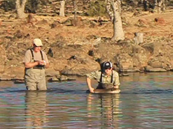 Sam hoisting Tim's biggest fish of the day
