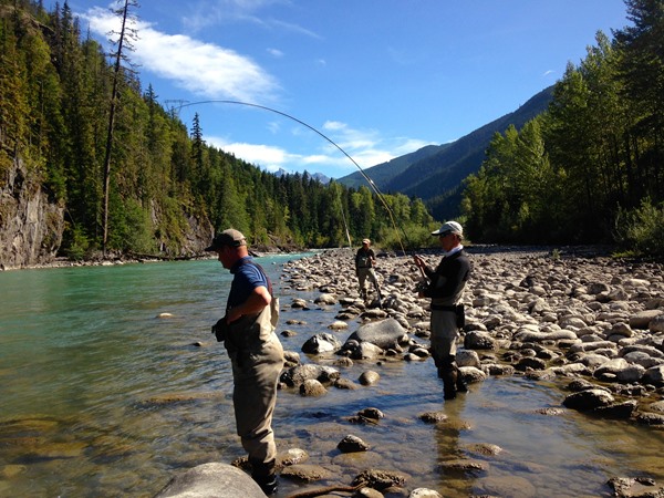 Mike bates battling a huge steelhead on an amazing river