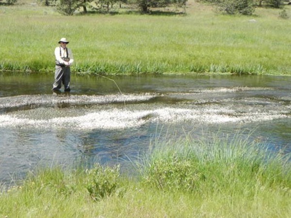 Dave fishing over a snowbank