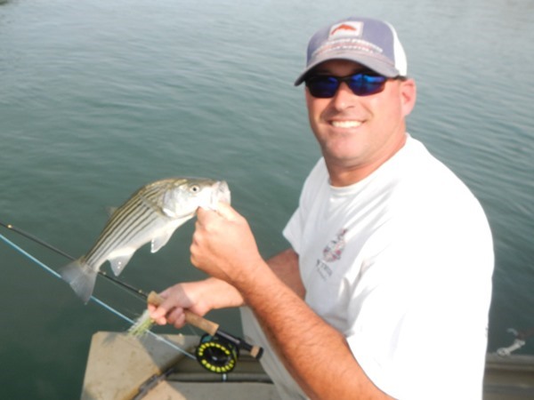 Mike with a typical striper for today