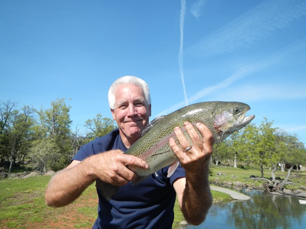 Cody with his first trout on a fly rod