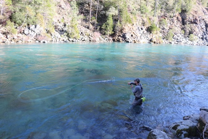 Neil punches a cast on the upper Smith River