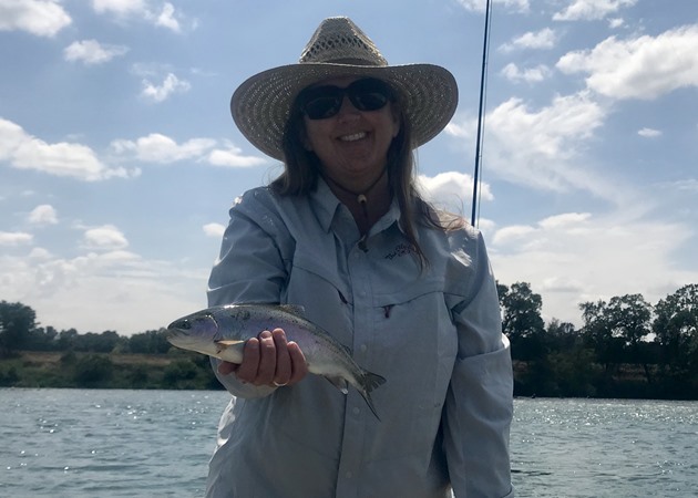 Donna with her first ever trout!