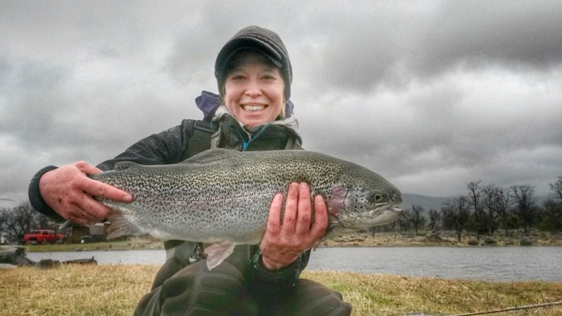 Novice angler Liz hooking up and landing the largest trout of her life