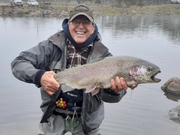 Dennis with one of the brutes he caught while stripping a streamer.