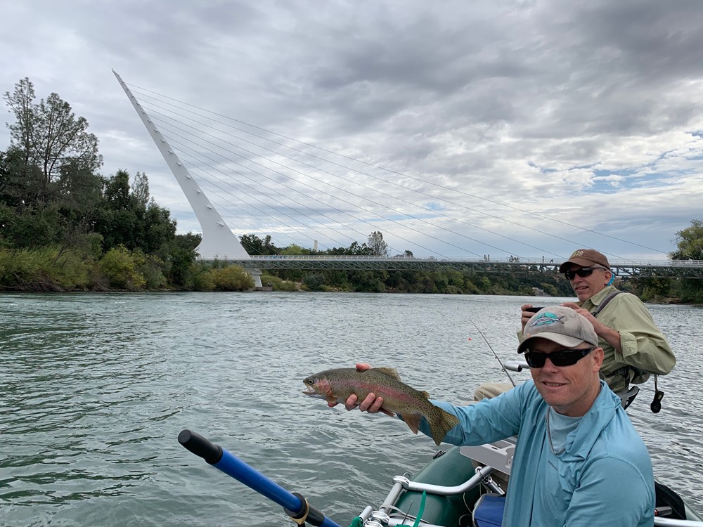 Bjorn with John's fish - the first fish landed in Bjorn's new raft