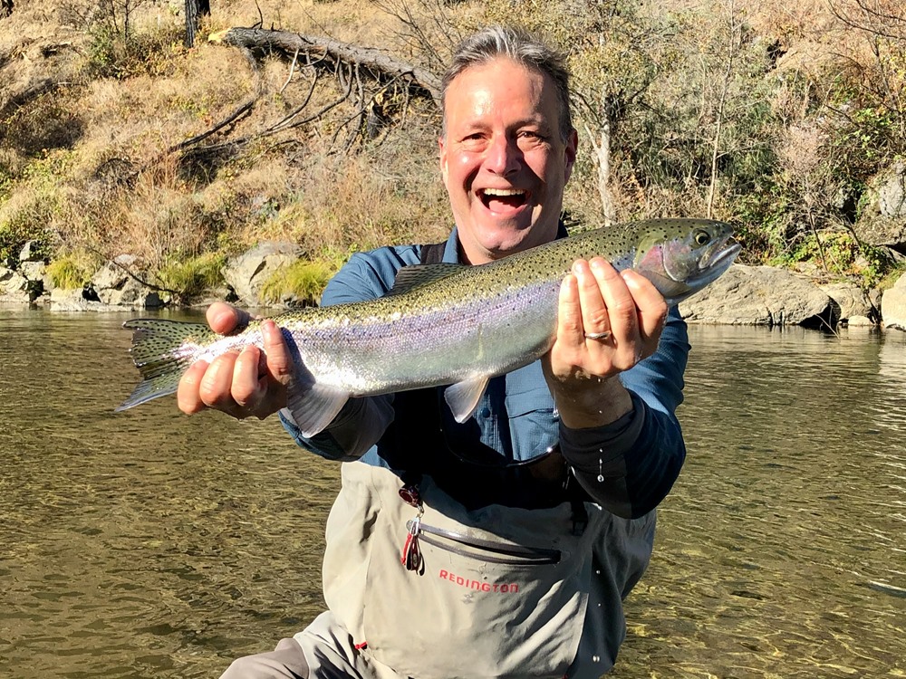 Tom is all smiles with his first ever steelhead!