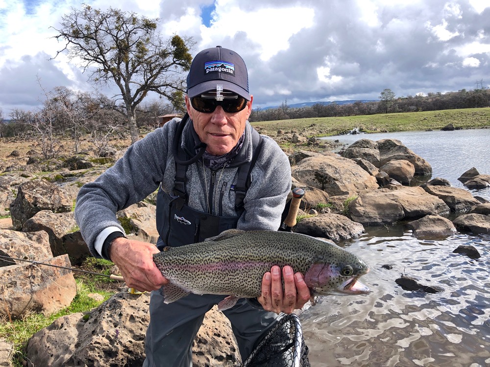 Dan with a nice rainbow caught with a purple wooly bugger.