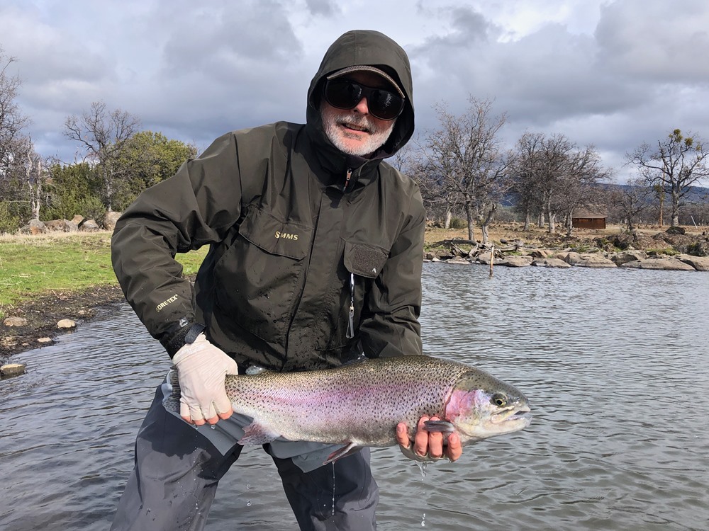 Mason with a hard fighting rainbow caught on a #10 rubber legs copper john.