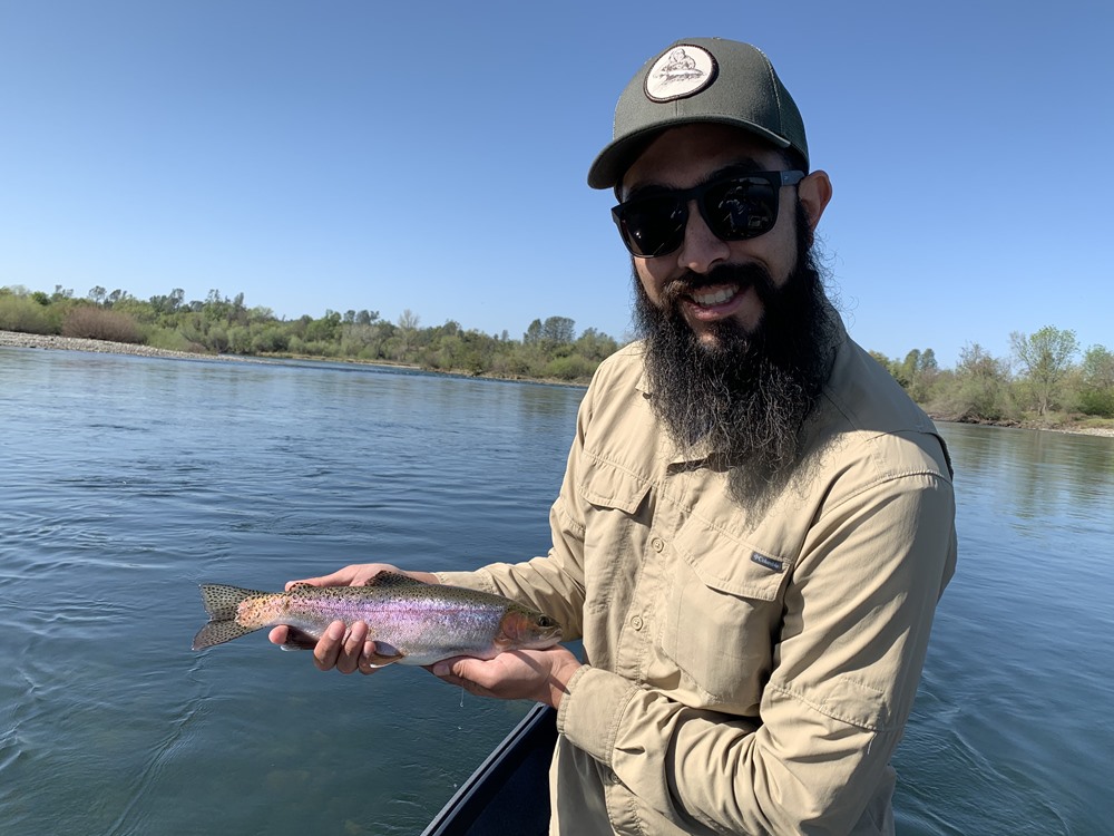 George with his first trout on a fly