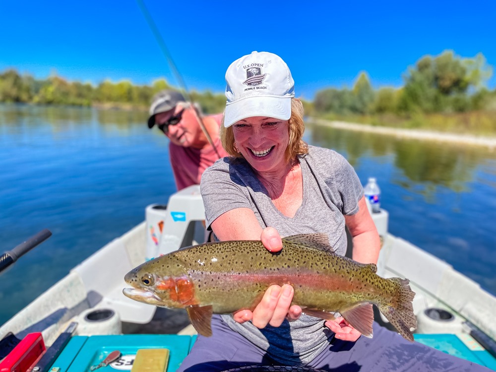 Tom photobombing another beautiful fish hooked by Cheryl. 