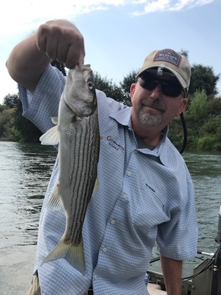 Dave with his first striper ever