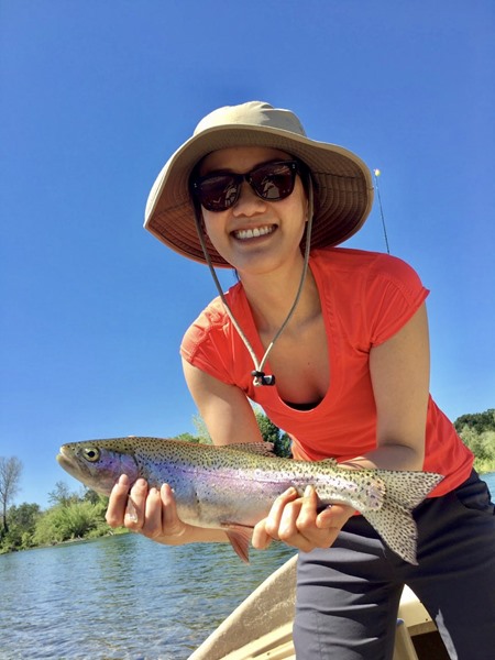 Marissa posing w her first rainbow trout!