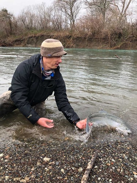 Andrew releasing a wild steelhead