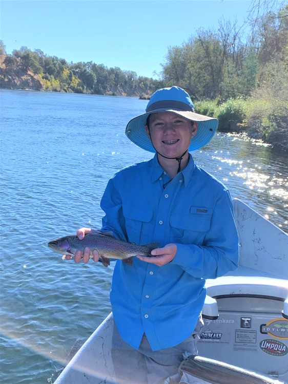 Jake with his first-ever trout on a fly
