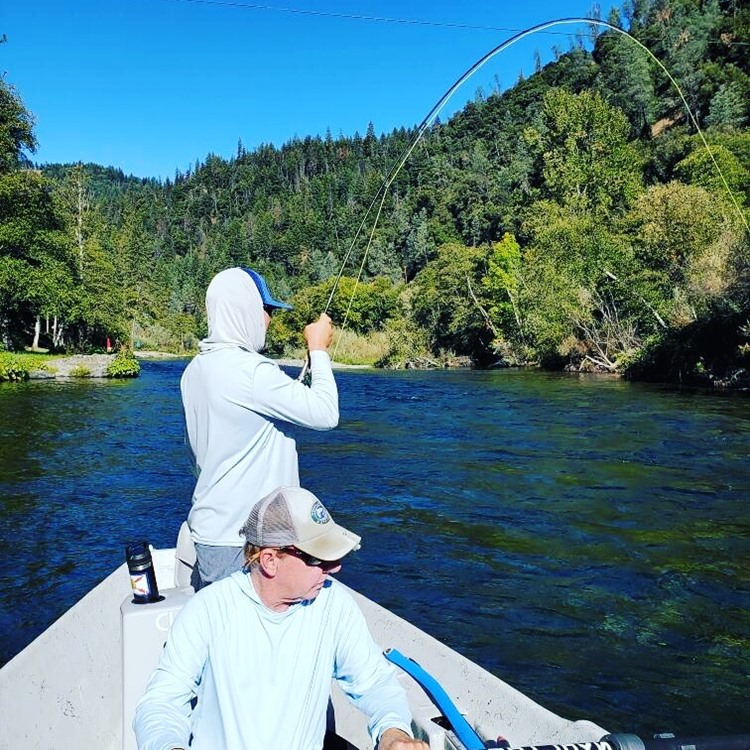 Peter Santley and guest playing a fish