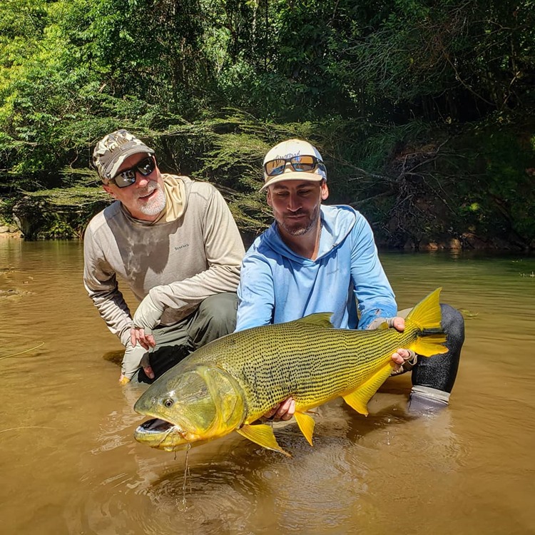 Chris with a truly mega Golden Dorado from a remote Bolivian tributary