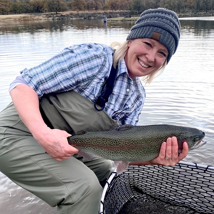 Liz used a slow retrieve to fool this large trout.